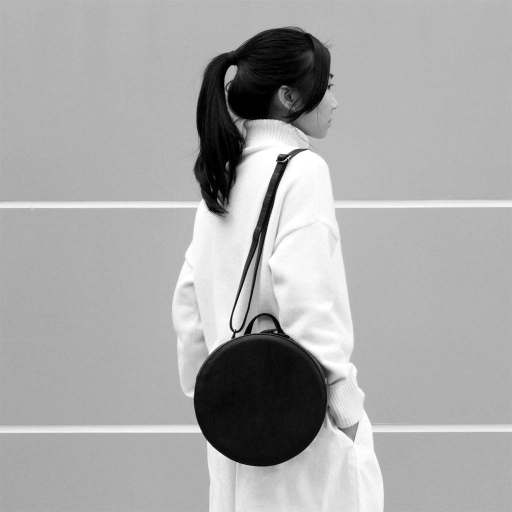 TAT_14595D_round leather shoulder bag backpack on model