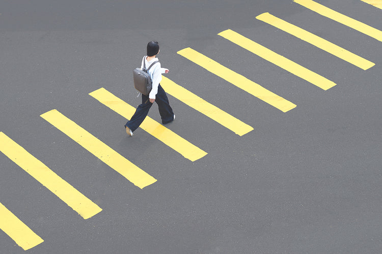 TAT_14597 square backpack on model on crosswalk