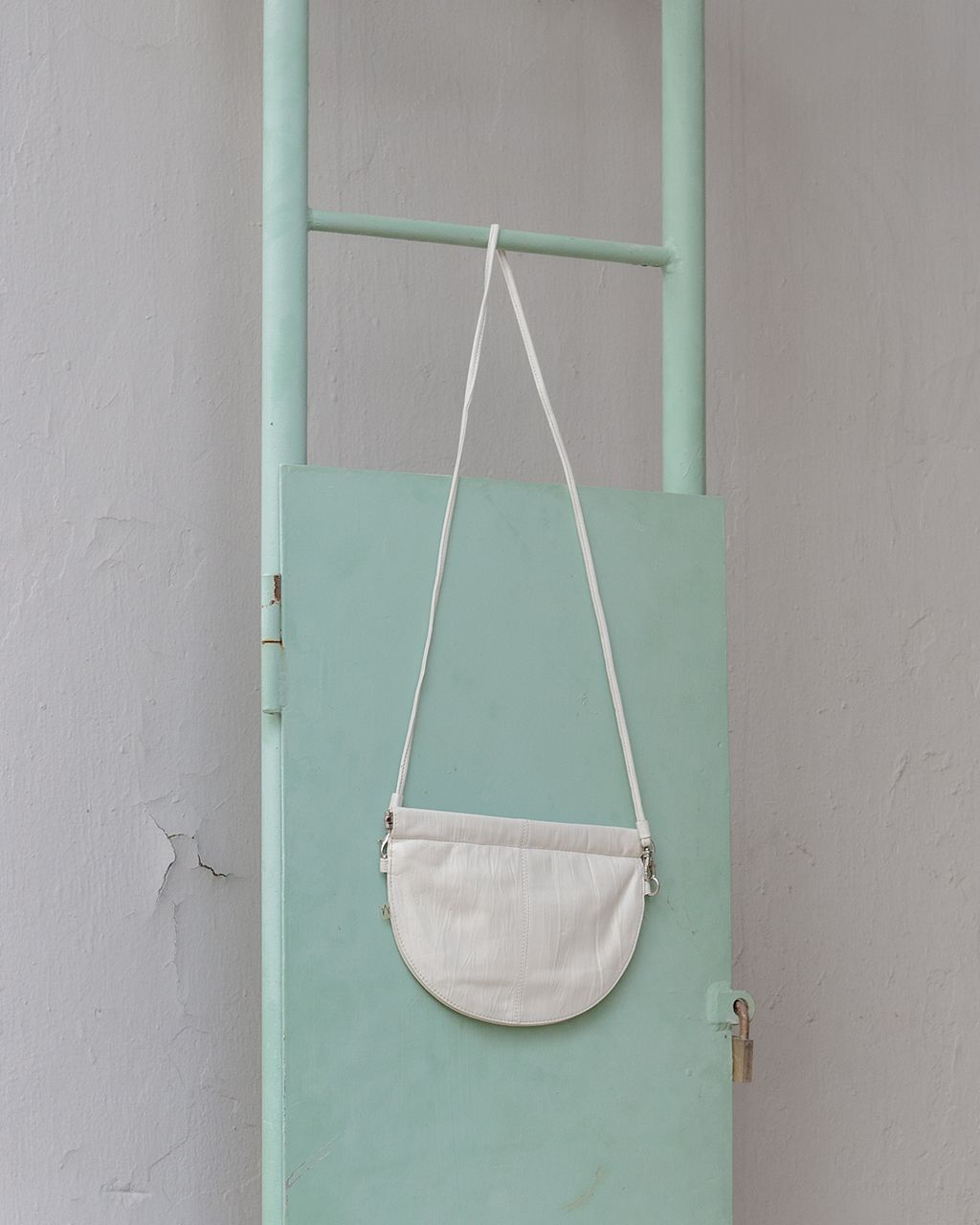 half moon crossbody bag in white 