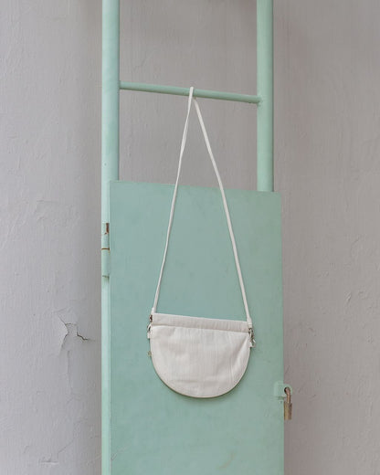 half moon crossbody bag in white 