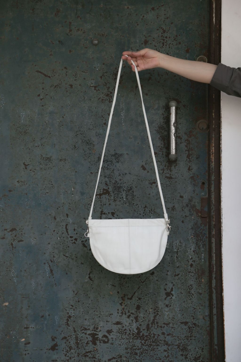 half moon crossbody bag in white 