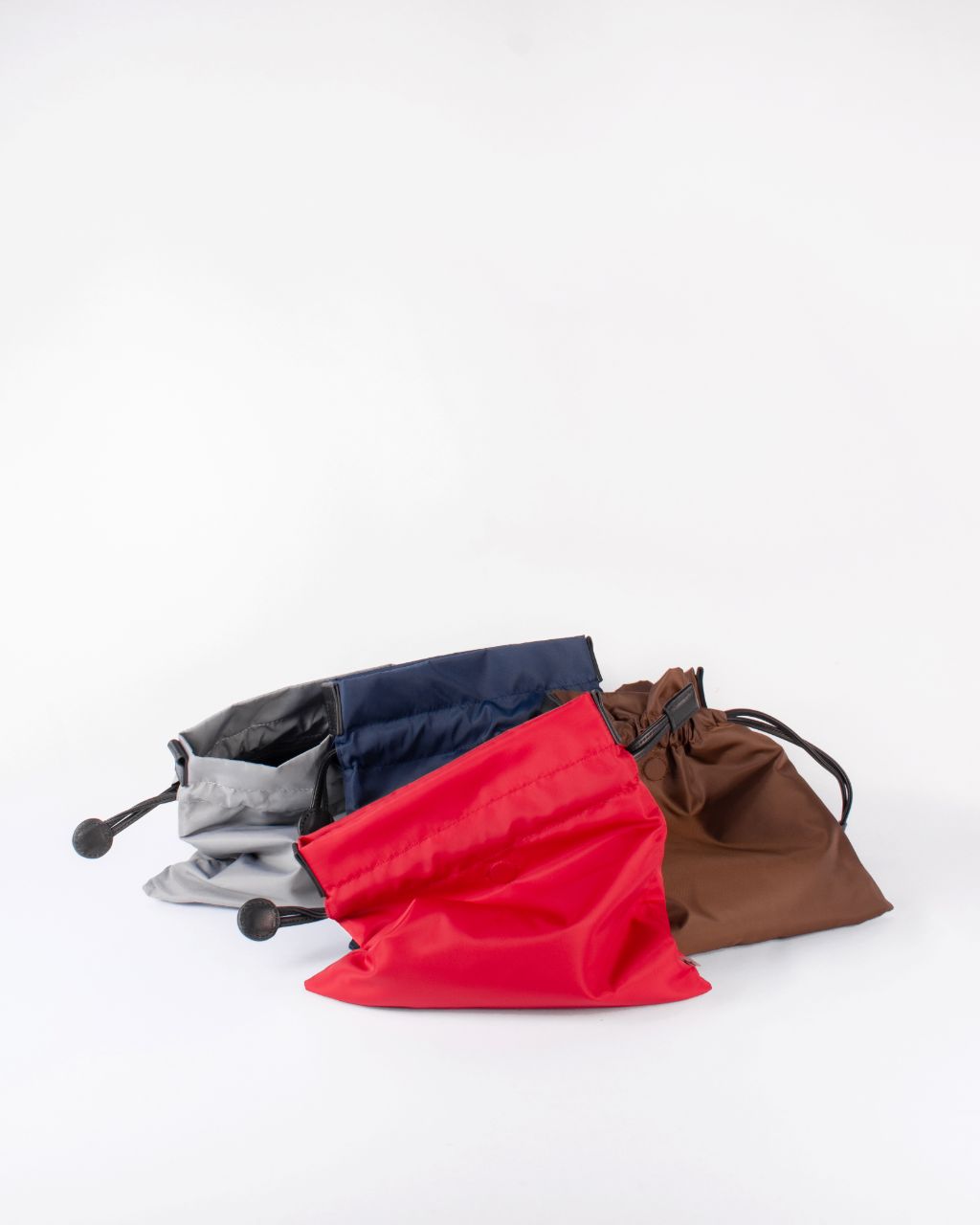 beans bag in red water repellent nylon and leather strap grey navy red brown