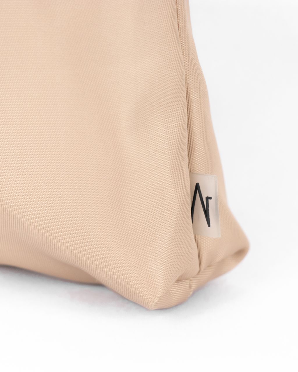 minimal workwear style  work pocket in khaki nylon logo close up
