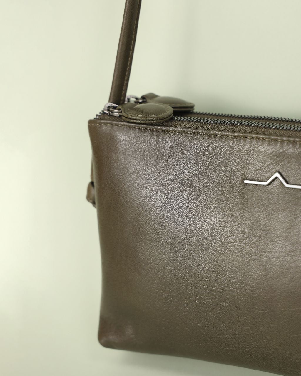 double zip rectangular crossbody in leather close up texture