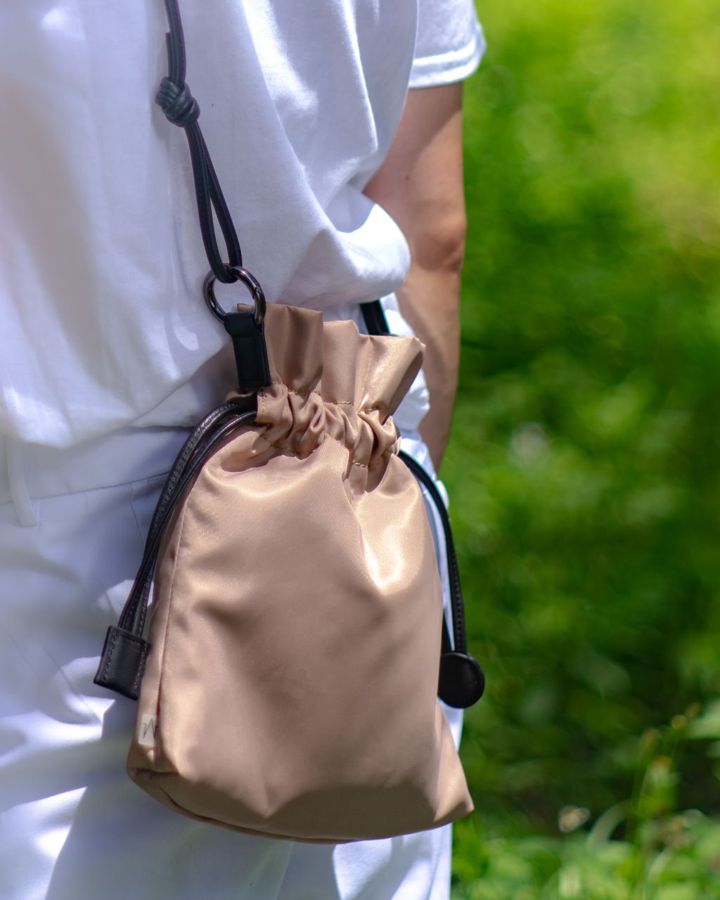 minimal workwear style  work pocket in khaki nylon on model