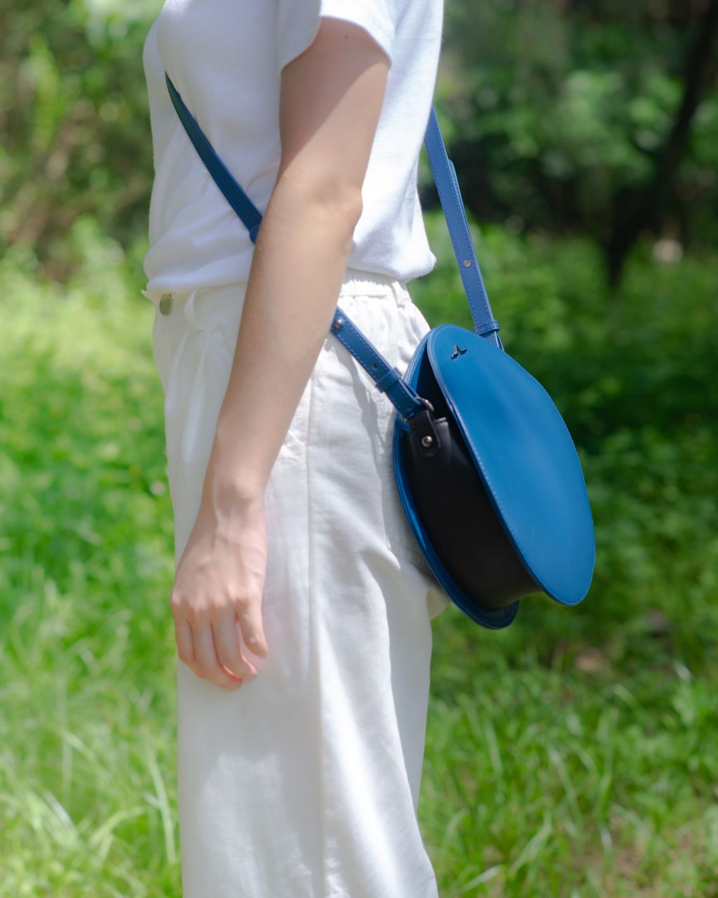 Blue circle Napa leather shoulder crossbody back on model