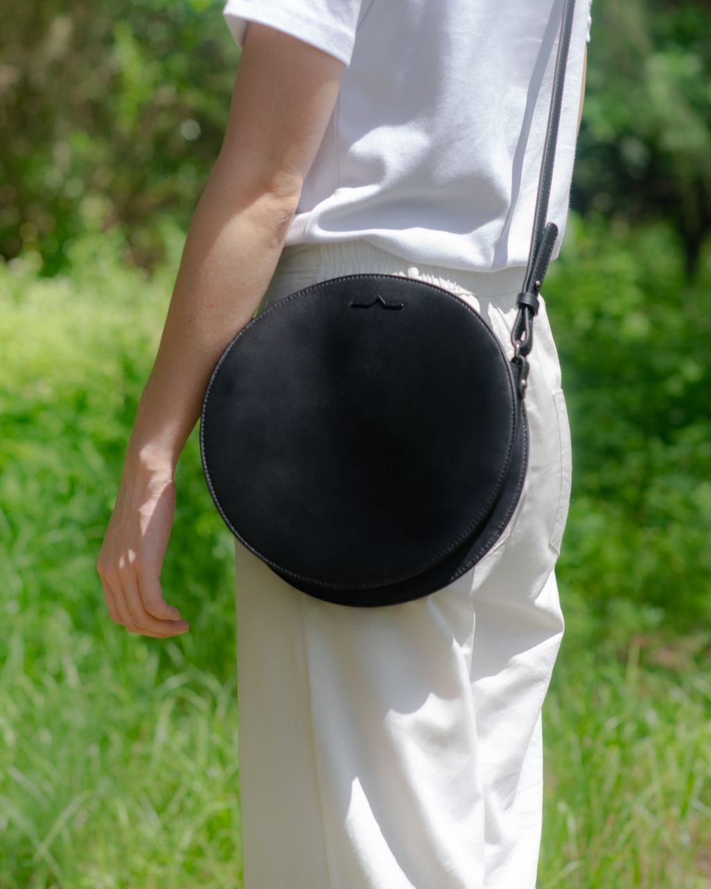 black circle cow leather crossbody on model