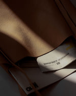 Workmate tote close up in Nappa Cow leather natural pattern details and hand feel under sunlight  