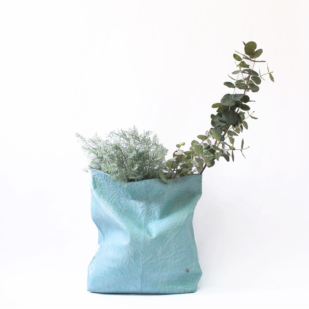 TAT_illusory_lunchbag clutch_14601_mint_front styling product shoot with flower