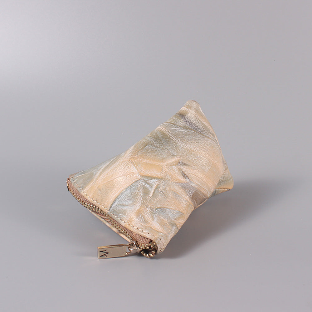 TAT_illusory mini pyramid_2290_nude_front with metal zipper puller