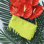 TAT_normcore_crossbody_14632_lemongreen_front styling photo shoot with flowers and leaves