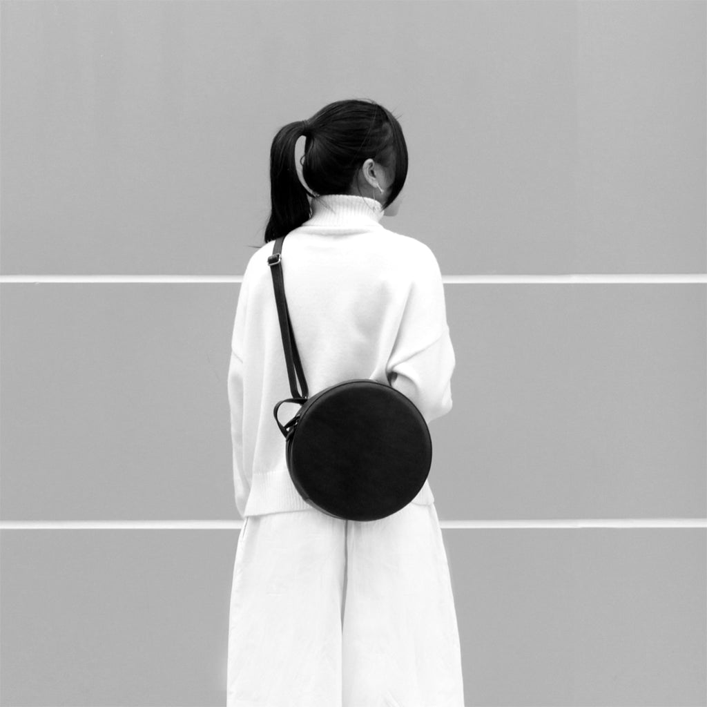 TAT_14595D_round crossbody backpack on model