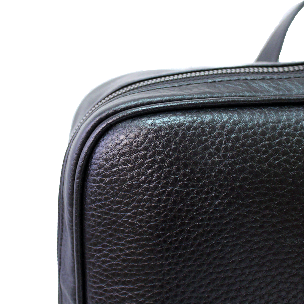black square leather backpack leather close up 