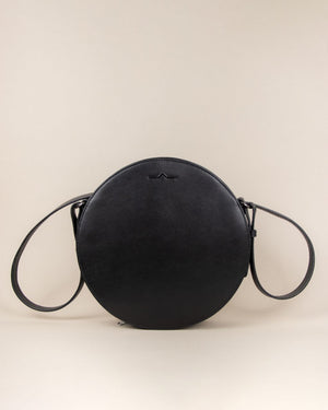 black circle cow leather crossbody with shoulder strap