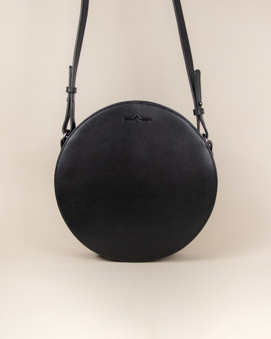 black circle cow leather crossbody front