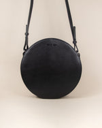 black circle cow leather crossbody front