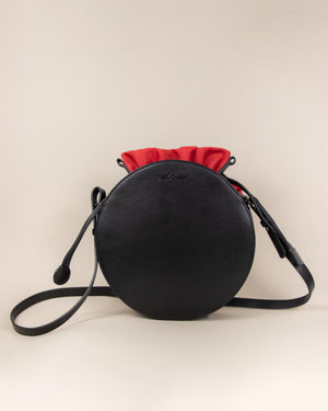 black circle cow leather crossbody with red nylon beans bag set
