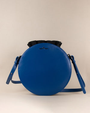 blue round cow leather crossbody with black nylon beans bag set