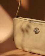 Pony Hair leather crossbody bag in beige TL-14632H_back embossed gold press logo
