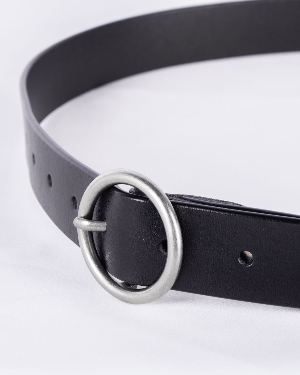 circle buckle belt metal close up
